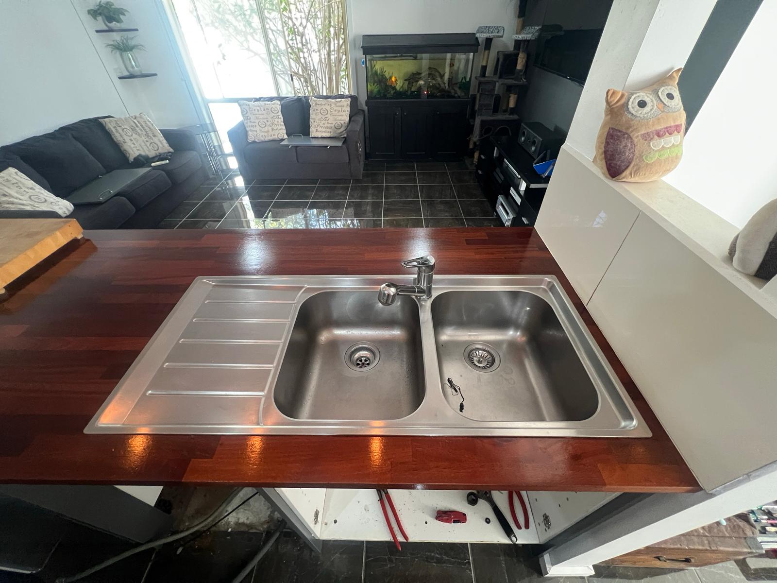 Old sink being removed in preparation for new sink